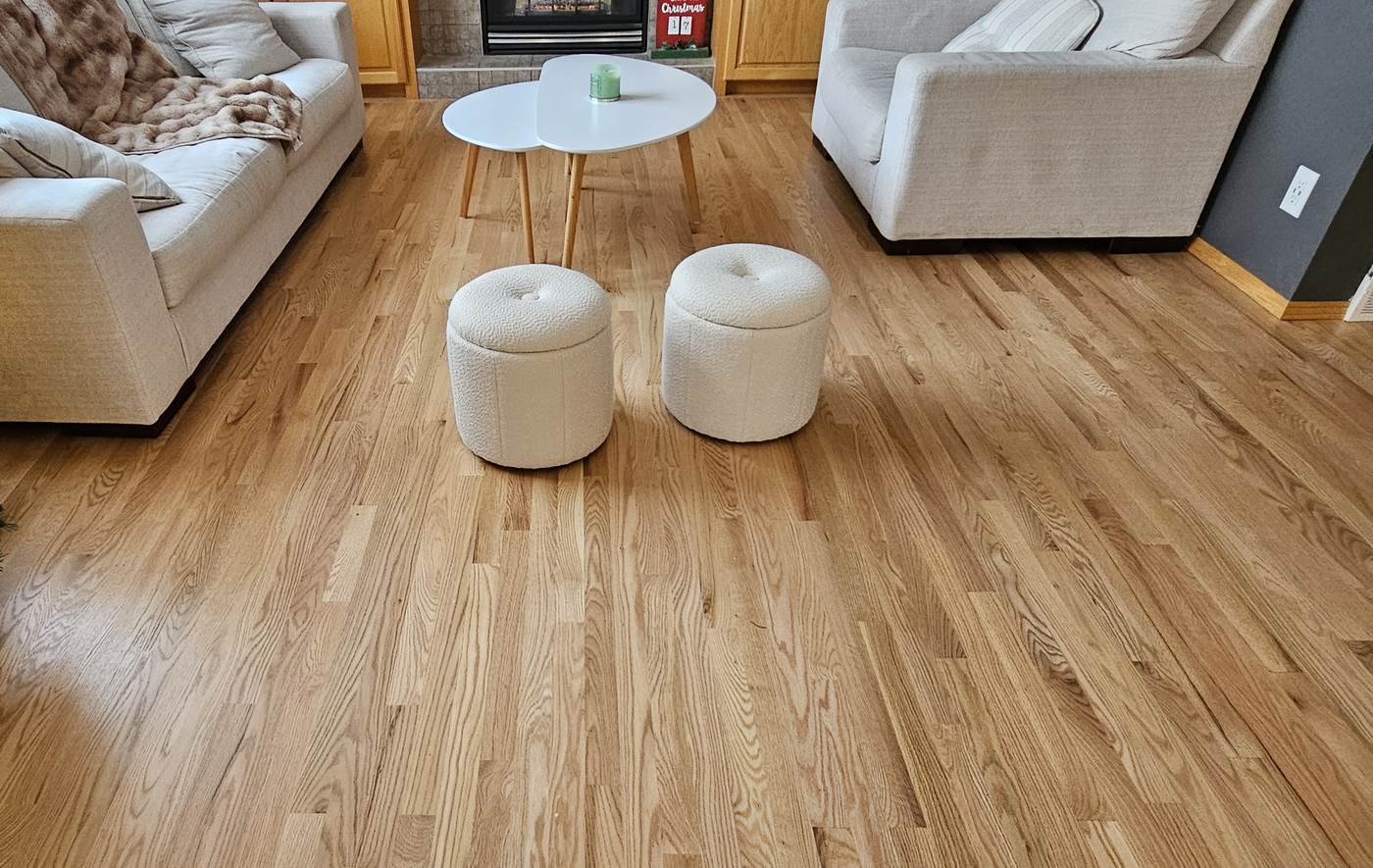 Real hardwood-floored living room with fireplace and built-in shelving, Wildrose Hardwood Calgary Airdrie flooring