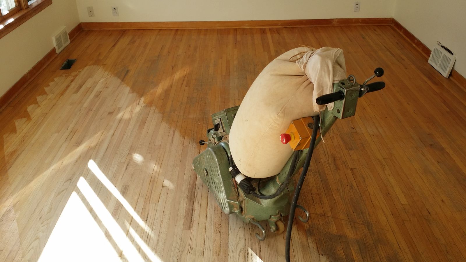 Drum sander refinishing a hardwood floor, Wildrose Hardwood, Calgary and Airdrie