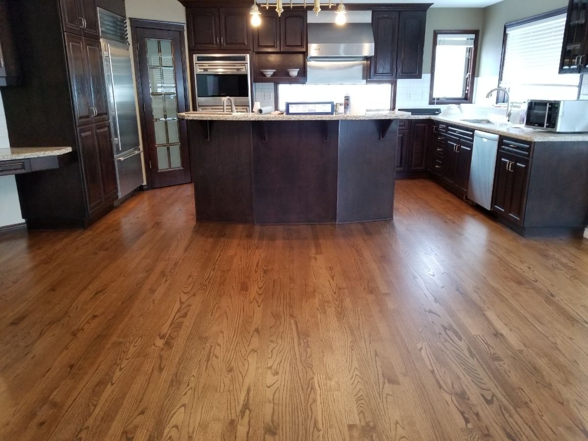 Worn red oak kitchen hardwood floor before refinishing, Calgary Airdrie flooring